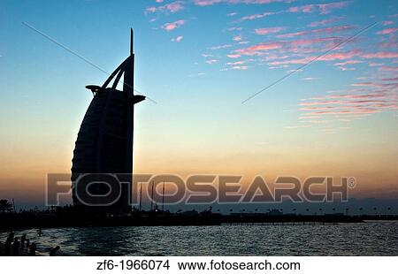 Worlds only 7 star hotel in Dubai UAE called the Burj Al Arab at sunset with luxury and water in United Arab Emirates. View Large Photo Image Picture - Worlds only 7 star hotel in Dubai UAE called the Burj Al Arab at sunset with luxury and water in United Arab Emirates.. Fotosearch