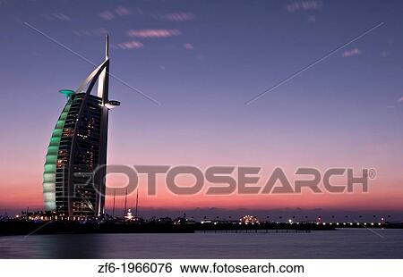 Worlds only 7 star hotel in Dubai UAE called the Burj Al Arab at sunset with luxury and water in United Arab Emirates. View Large Photo Image Stock Photograph - Worlds only 7 star hotel in Dubai UAE called the Burj Al Arab at sunset with luxury and water in United Arab Emirates.. Fotosearch