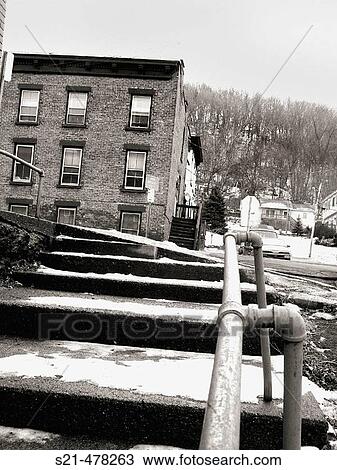 Worn steps and an old brick tenement building are captured during the winter in New England. View Large Photo Image Stock Image - Worn steps and an old brick tenement building are captured during the winter in New England.. Fotosearch