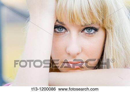 Worried young woman portrait framed with her hands View Large Photo Image Stock Photograph - Worried young woman portrait framed with her hands. Fotosearch