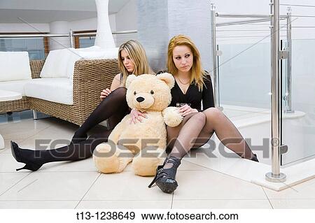 Worried young women with a teddy gear View Large Photo Image Stock Photo - Worried young women with a teddy gear. Fotosearch