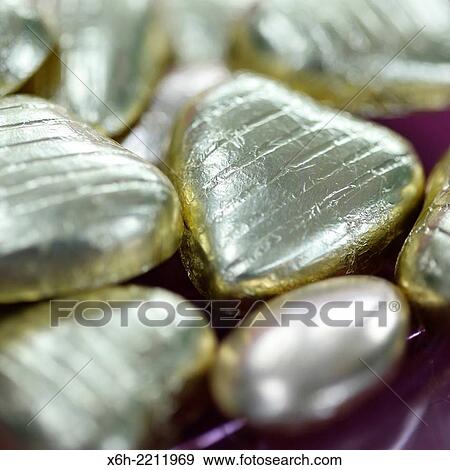 wrapped chocolate heart shaped sweets for someone special. View Large Photo Image Stock Photo - wrapped chocolate heart shaped sweets for someone special.. Fotosearch