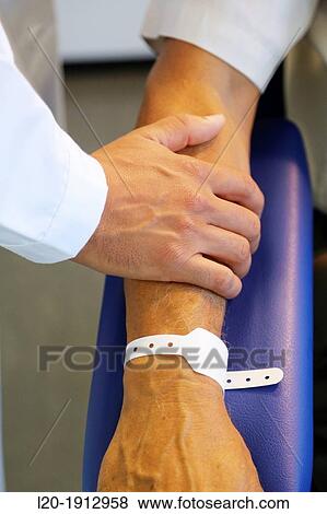 Wristband, Doctor with patient, Onkologikoa Hospital, Oncology Institute, Case Center for prevention, diagnosis and treatment of cancer, Donostia, San Sebastian, Gipuzkoa, Basque Country, Spain View Large Photo Image Stock Photo - Wristband, Doctor with patient, Onkologikoa Hospital, Oncology Institute, Case Center for prevention, diagnosis and treatment of cancer, Donostia, San Sebastian, Gipuzkoa, Basque Country, Spain. Fotosearch