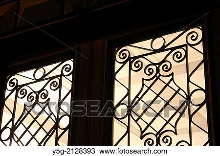 wrought iron pattern grill on door in rome italy View Large Photo Image Stock Image - wrought iron pattern grill on door in rome italy. Fotosearch