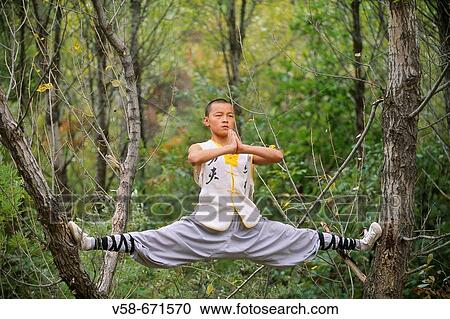 Stock Image - Wushu student practising kung fu, shaolin, China. Fotosearch