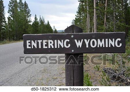 Stock Image - WYOMING USA Sign in Yellowstone National Park.. Fotosearch