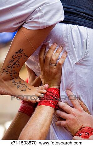 Stock Image - Xicots de Vilafranca? Castellers? building human tower, a Catalan tradition Pla? a de la Vila de Gr? cia Barri de Gr? cia Barcelona, Spain. Fotosearch