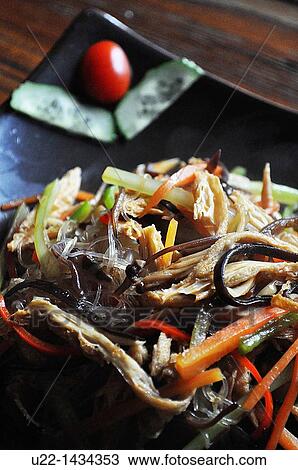Stock Image - Yangshou (China): Lo Han Zhai Guilin style (or Buddha delight, vegetarian plate for monks, a mix of noodles and veggies) at Pure Lotus restaurant. Fotosearch