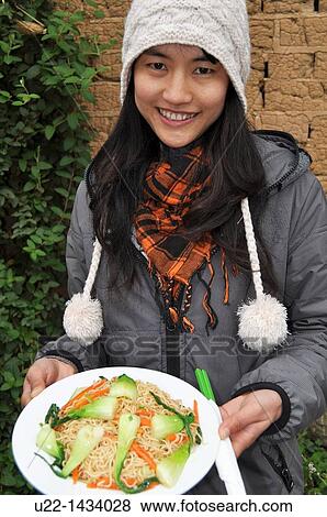 Yangshou (China): noodles with veggies at the Giggling Tree Lodge, in the near village of Aishanmen View Large Photo Image Stock Photo - Yangshou (China): noodles with veggies at the Giggling Tree Lodge, in the near village of Aishanmen. Fotosearch