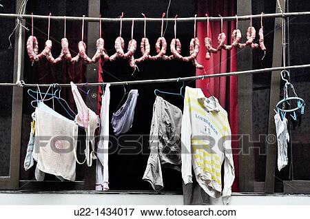 Yangshou (China): sausages and laundry drying by a window View Large Photo Image Stock Photo - Yangshou (China): sausages and laundry drying by a window. Fotosearch