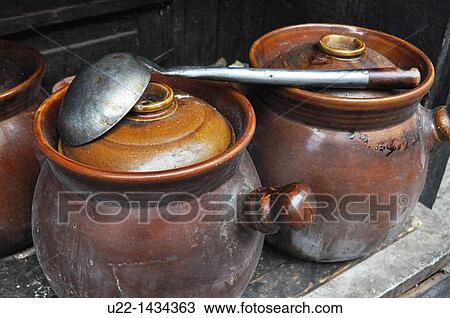Stock Image - Yangshou (China): traditional pots for food outside a restaurant. Fotosearch