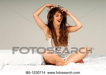 Yawning young girl recently raised View Large Photo Image Picture - Yawning young girl recently raised. Fotosearch