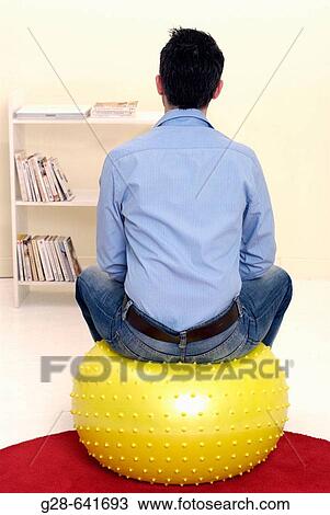 Stock Image - Yellow balloon in sitting room.. Fotosearch