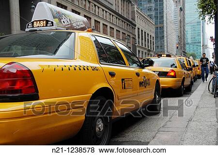 Stock Photo - Yellow cabs in Manhattan. New York, New York. USA.. Fotosearch
