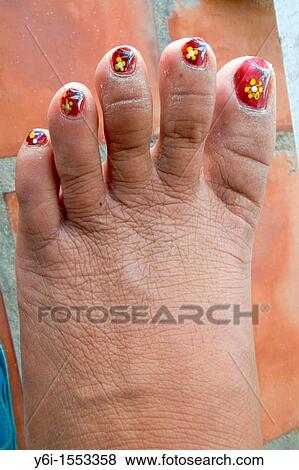 Yellow flowers painted on toes with nail varnish in Phu Quoc Island Vietnam View Large Photo Image Stock Photo - Yellow flowers painted on toes with nail varnish in Phu Quoc Island Vietnam. Fotosearch