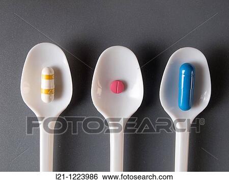 Yellow, pink and blue pills in white plastic spoons. Gray background. View Large Photo Image Stock Photograph - Yellow, pink and blue pills in white plastic spoons. Gray background.. Fotosearch