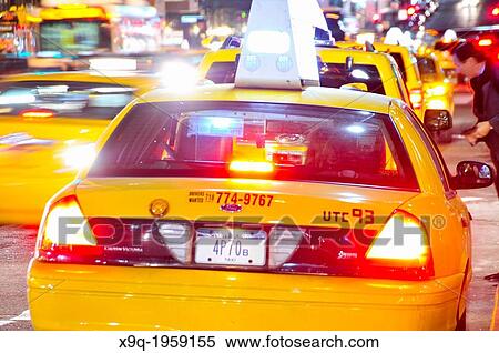 Stock Photography - Yellow taxi cabs, Mass transit, adjacent to Grand Central Terminal, Park Avenue, Vanderbilt Avenue, Manhattan, Midtown, New York City, USA.. Fotosearch