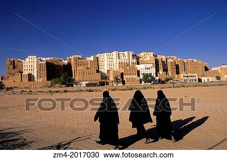 YEMEN, WADI HADRAMAWT, VIEW OF SHIBAM, VEILED WOMEN, 'MANHATTAN OF THE DESERT'. View Large Photo Image Stock Image - YEMEN, WADI HADRAMAWT, VIEW OF SHIBAM, VEILED WOMEN, 'MANHATTAN OF THE DESERT'.. Fotosearch