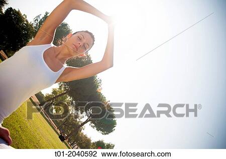 yoga girl in a park. View Large Photo Image Stock Image - yoga girl in a park.. Fotosearch