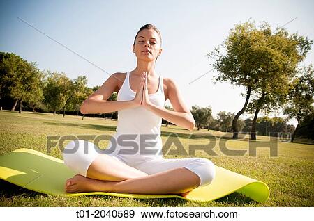 yoga girl in a park. View Large Photo Image Stock Photo - yoga girl in a park.. Fotosearch