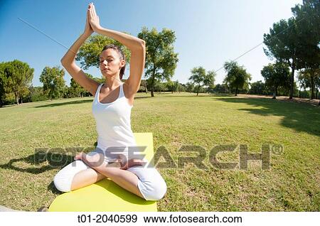 yoga girl in a park. View Large Photo Image Stock Photo - yoga girl in a park.. Fotosearch