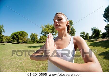 yoga girl in a park. View Large Photo Image Stock Photography - yoga girl in a park.. Fotosearch
