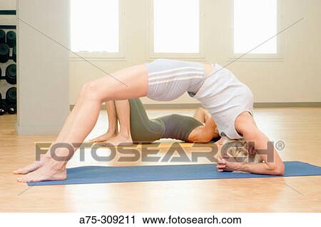 Stock Image - yoga, stretching. Fotosearch