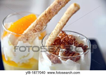 Yogourt with fruits and crispies on cup View Large Photo Image Stock Image - Yogourt with fruits and crispies on cup. Fotosearch