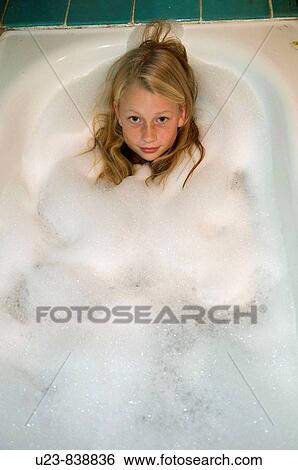 Yong girl in the bath tube View Large Photo Image Stock Photograph - Yong girl in the bath tube. Fotosearch