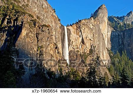 Yosemite, Bridalveil Falls and Leaning Tower at sunset from Yosemite Valley at Yosemite National Park in California. View Large Photo Image Picture - Yosemite, Bridalveil Falls and Leaning Tower at sunset from Yosemite Valley at Yosemite National Park in California.. Fotosearch