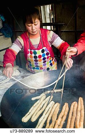 You tiao, you char kway, or yau ja gwai are local names for fried Chinese bread are sold throughout China View Large Photo Image Stock Photo - You tiao, you char kway, or yau ja gwai are local names for fried Chinese bread are sold throughout China. Fotosearch