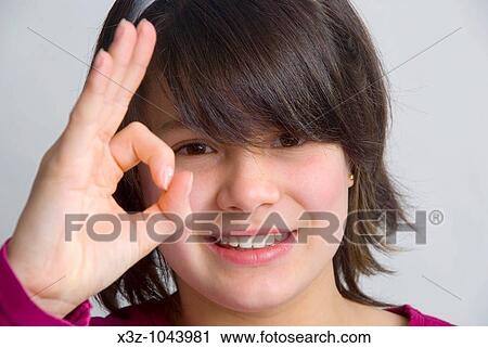 Young 11 year old girl giving the OK sign View Large Photo Image Stock Image - Young 11 year old girl giving the OK sign. Fotosearch