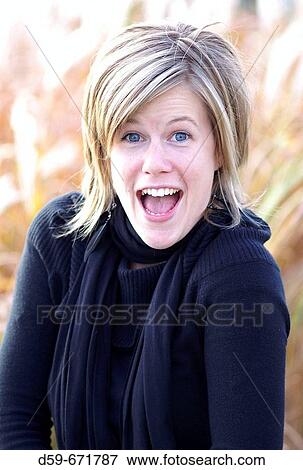 Young 25 year old woman with a surprized look on face View Large Photo Image Stock Photo - Young 25 year old woman with a surprized look on face. Fotosearch