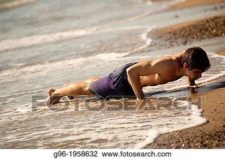 Young adult running at the beach. View Large Photo Image Stock Image - Young adult running at the beach.. Fotosearch