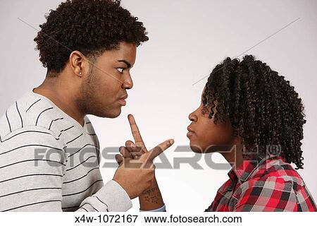 Stock Photo - Young African-American couple facing off? Katharine Andriotis. Fotosearch