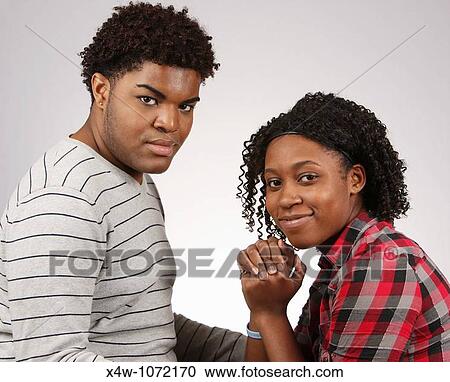 Young African-American couple posing for portrait? Katharine Andriotis View Large Photo Image Stock Image - Young African-American couple posing for portrait? Katharine Andriotis. Fotosearch