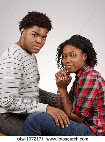 Young African-American couple posing for portrait? Katharine Andriotis View Large Photo Image Stock Image - Young African-American couple posing for portrait? Katharine Andriotis. Fotosearch