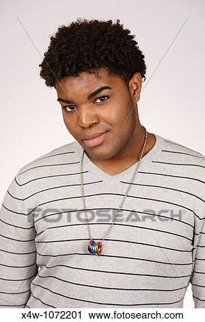Young African-American man posing for portrait View Large Photo Image Stock Image - Young African-American man posing for portrait. Fotosearch