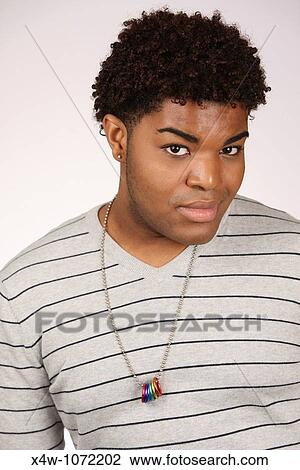 Young African-American man posing for portrait View Large Photo Image Stock Image - Young African-American man posing for portrait. Fotosearch