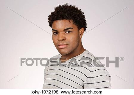 Stock Photo - Young African-American man posing for portrait. Fotosearch