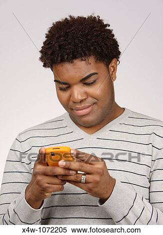 Young African American Man Texting Stock Photography X4w 1072205