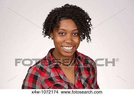 Young African-American woman posing for portrait View Large Photo Image Picture - Young African-American woman posing for portrait. Fotosearch