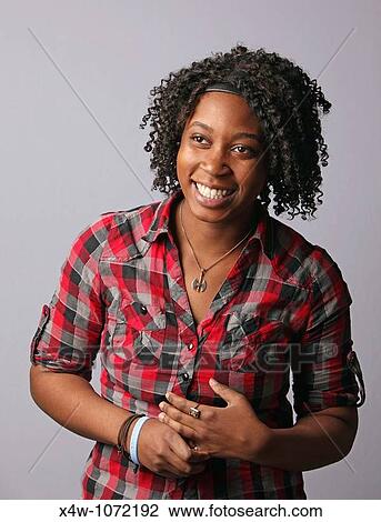 Young African-American woman posing for portrait View Large Photo Image Stock Image - Young African-American woman posing for portrait. Fotosearch