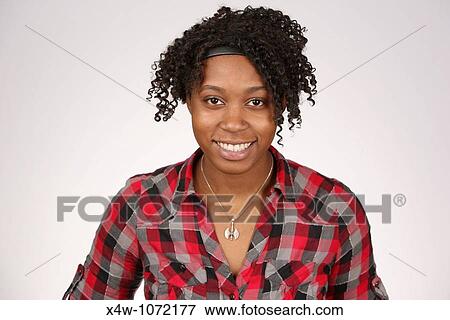 Stock Photo - Young African-American woman posing for portrait. Fotosearch