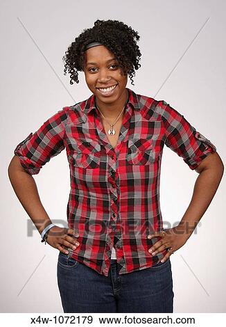 Stock Photo - Young African-American woman posing for portrait. Fotosearch