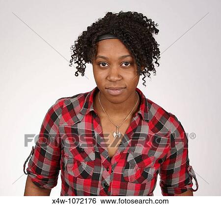 Stock Photograph - Young African-American woman posing for portrait. Fotosearch