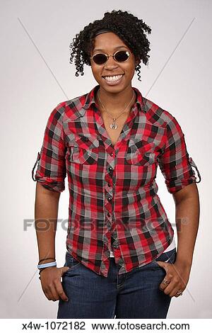 Young African-American woman with sunglasses posing for portrait View Large Photo Image Stock Image - Young African-American woman with sunglasses posing for portrait. Fotosearch