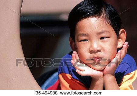 Young Asian Boy at the Park View Large Photo Image Stock Photo - Young Asian Boy at the Park. Fotosearch