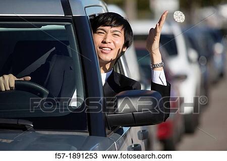 Young Asian businessman in a traffic jam View Large Photo Image Stock Image - Young Asian businessman in a traffic jam. Fotosearch