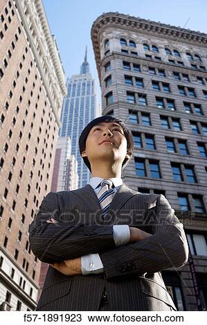 Young Asian businessman in New York City View Large Photo Image Stock Image - Young Asian businessman in New York City. Fotosearch